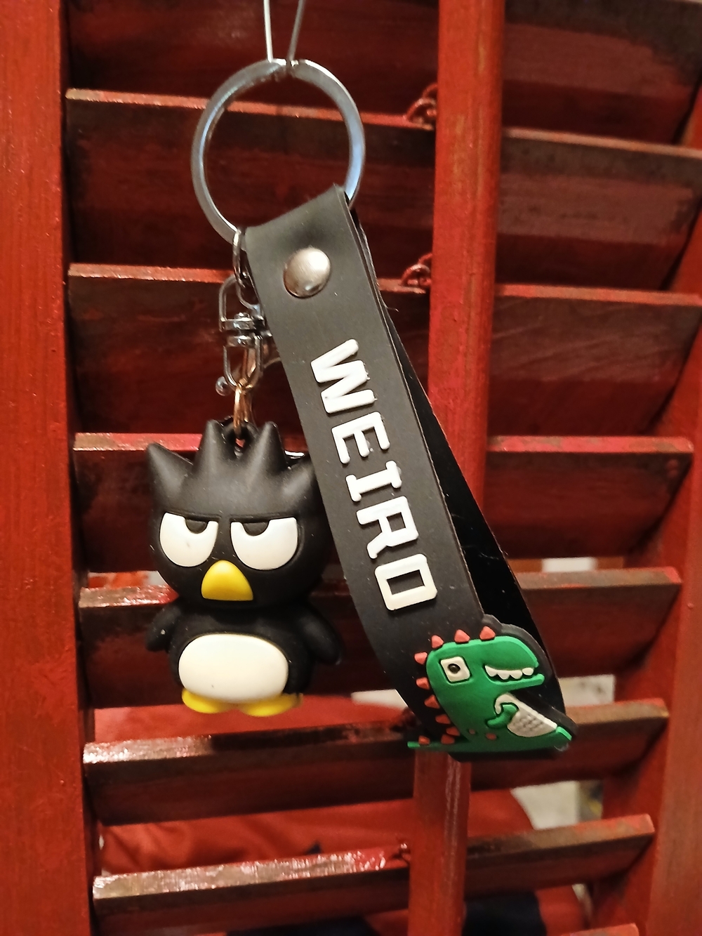 IRO Black Bird Keychain with Green Dinosaur Charm